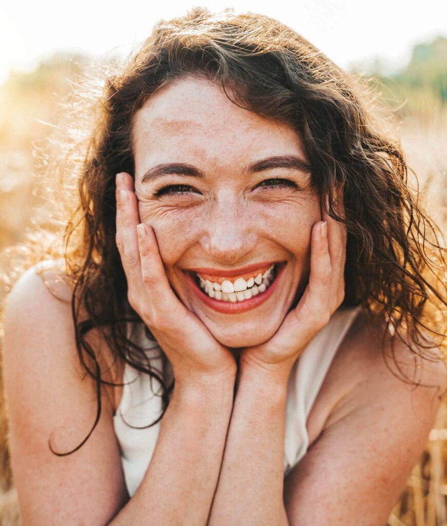 smiling woman meadow